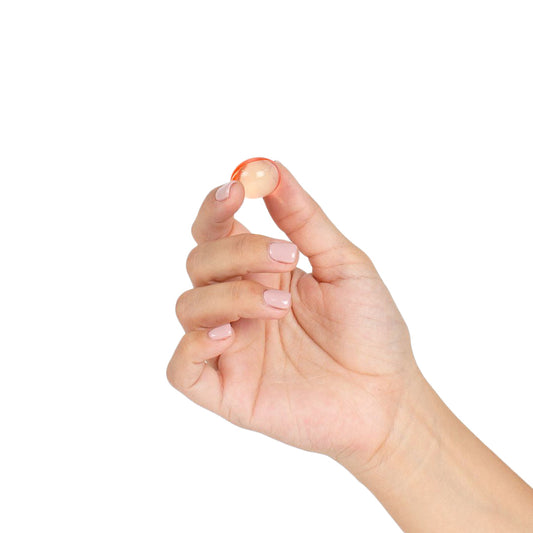 Aceite de masaje con bolas brasileñas y efecto cálido